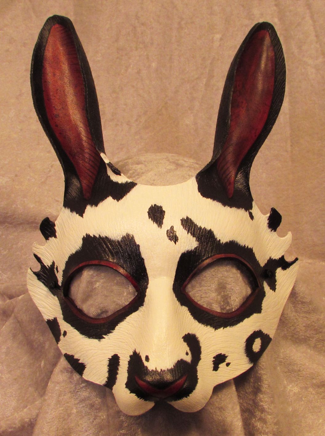 Black & white speckled rabbit mask.